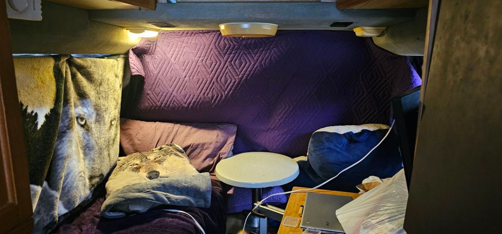 Winter RV Life with warming wall and blankets. 