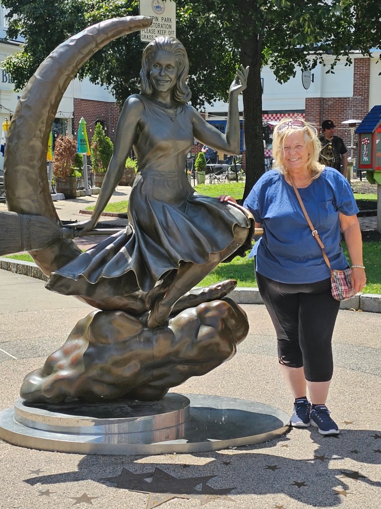 A picture of me beside the Bewitched statue in Salem