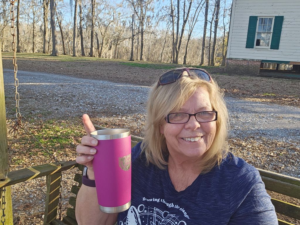 Sitting in the swing by the church of Spectre