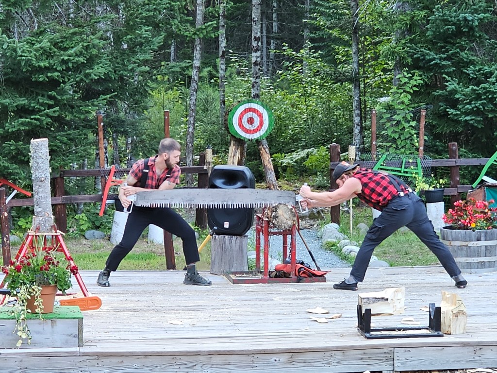 working the long saw at the lumberjack show